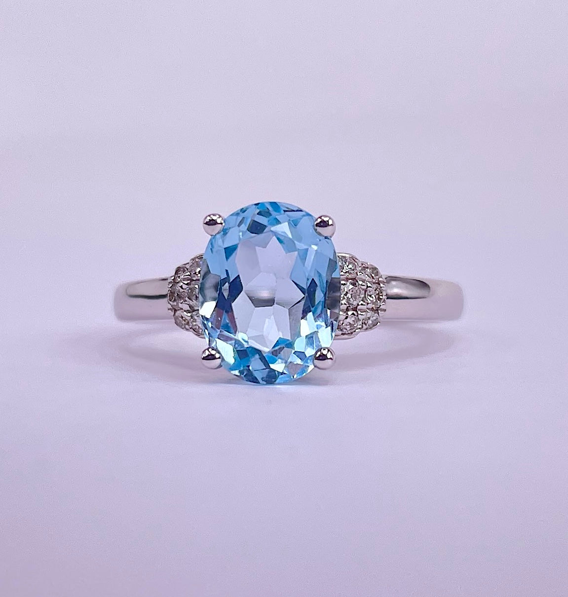 9K White Gold Ring with Oval Blue Topaz & Diamonds