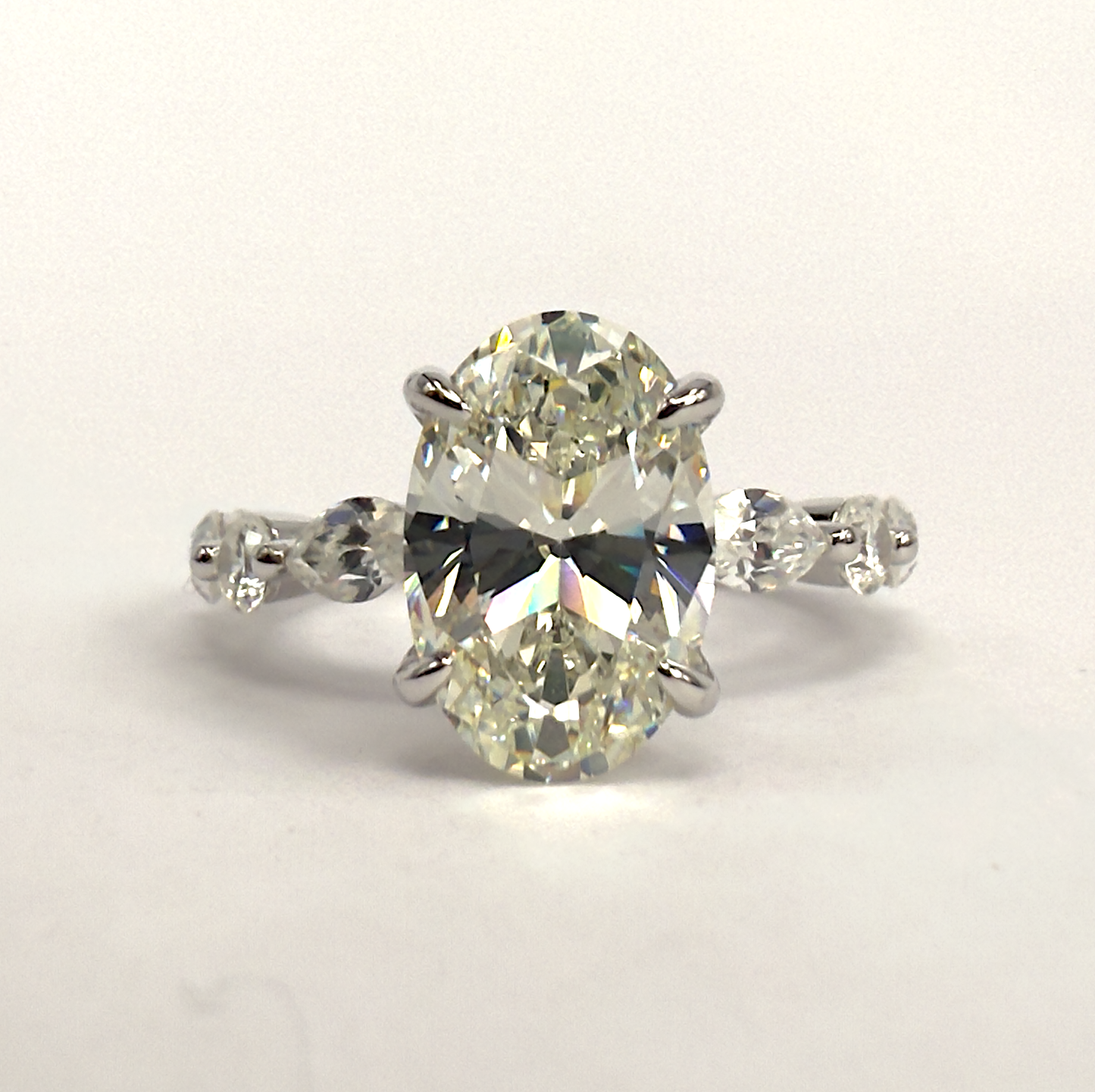 Sterling Silver Ring with Oval Cubic Zirconia & Marquise Accent Band
