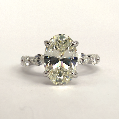 Sterling Silver Ring with Oval Cubic Zirconia & Marquise Accent Band